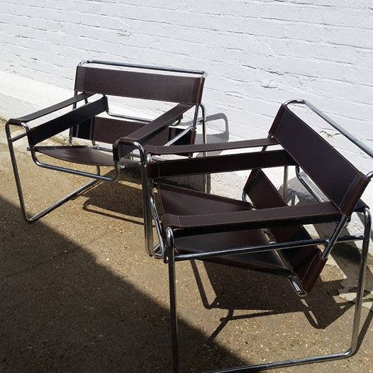 Deep Brown Marcel Breuer Chairs with contrasting stitching