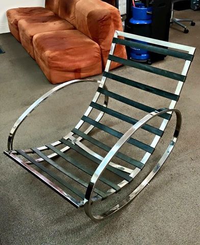 A Milo Baughman rocking chair arrives without a cushion