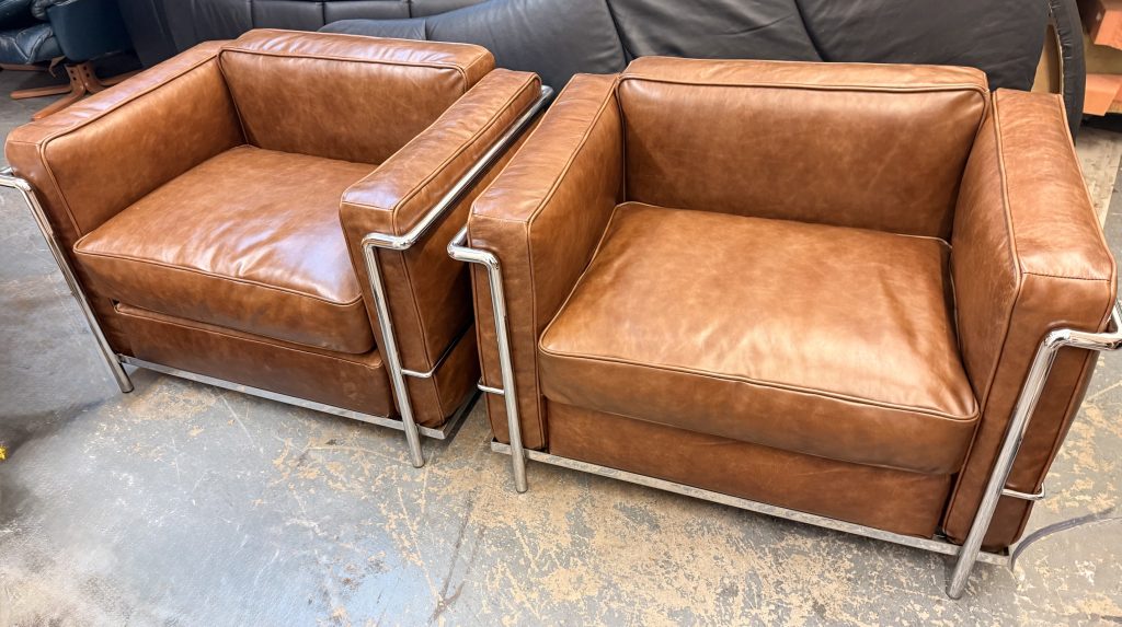 Cassina Le Corbusier LC2 chairs restored and reupholstered in aniline leather by experts in the restoration of Mid century modern furniture